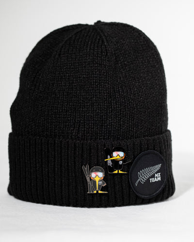 Black beanie with embroidered designs on a white background