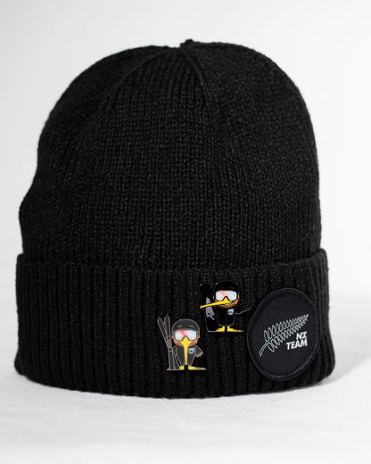 Black beanie with embroidered designs on a white background