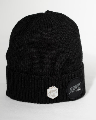 Black beanie with embroidered logos on a white background