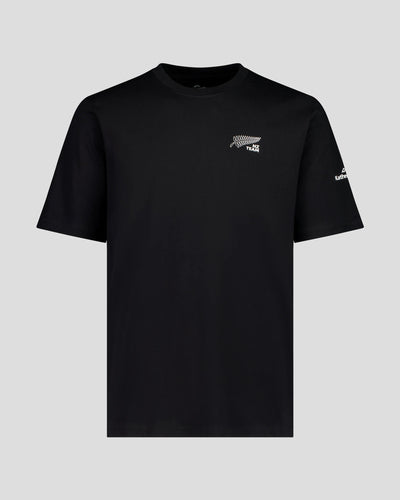 Man wearing a black t-shirt with NZ Team logo on front left side